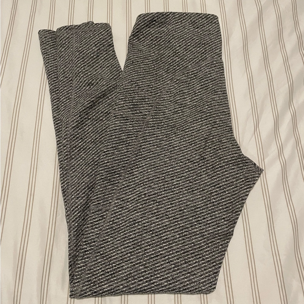 Grey and white striped, high waisted leggings.